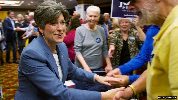 Joni Ernst shakes hands