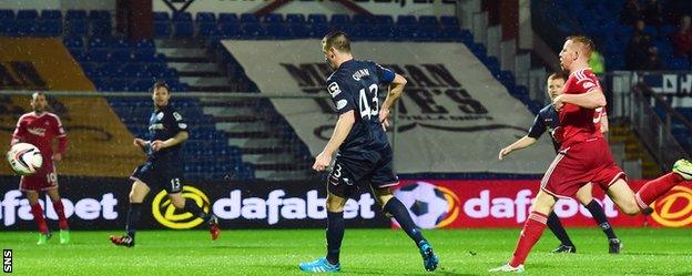 Ross County defender Paul Quinn diverts the ball beyond his own goalkeeper to send Aberdeen 1-0 up