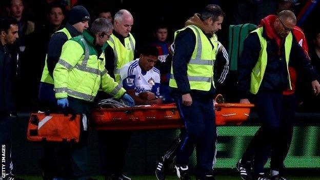 Sunderland defender Patrick van Aanholt is carried from the field