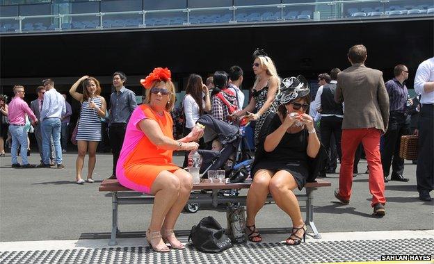 Women eating sandwiches at Randwick Racecourse