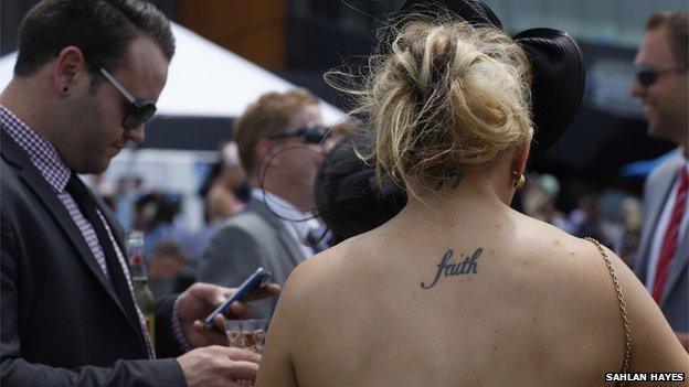 Woman with 'Faith' tattoo