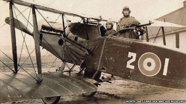 Gunner Capt John Hedley (standing)