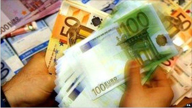 Cashier counting euro notes