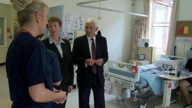 Peter Higson and Margaret Hanson talking to hospital staff