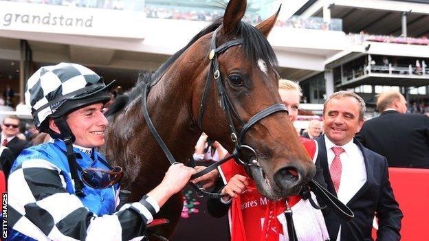 Jockey Ryan Moore with Melbourne Cup winner Protectionist and trainer Andreas Wohler