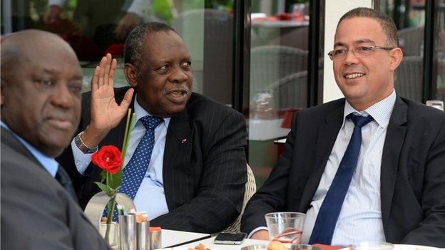 Caf president Issa Hayatou (second left) speaks to Fouzi Lekjaa (R), president of the Moroccan Football Federation (FRMF), in Rabat on 3 November, 2014