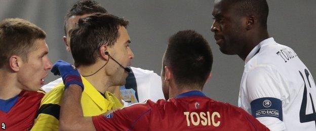 Manchester City's Yaya Toure (r) speaks to the referee Ovidiu Hategan (l) during the Champions League match between CSKA Moscow and Manchester City