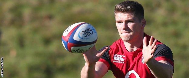 Owen Farrell prepares to catch a pass in England training