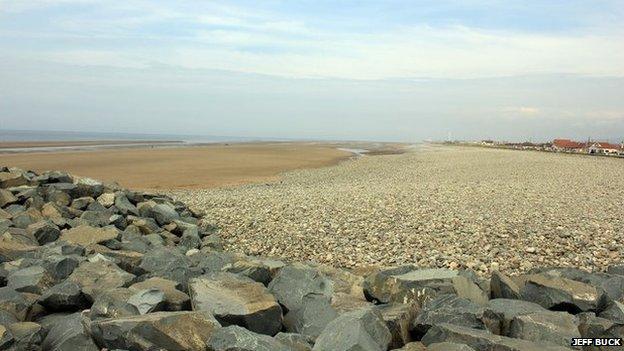 Looking across the sea wall towards Kinmel Bay