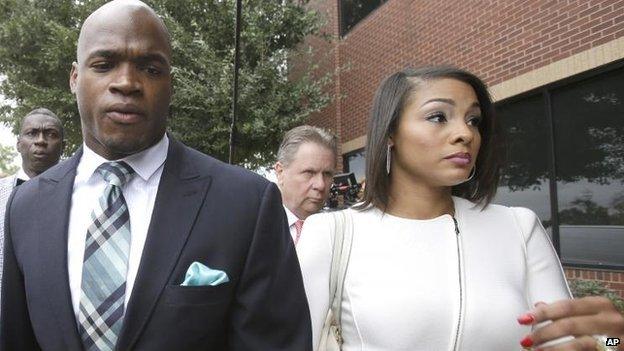 Adrian Peterson arrives at the courthouse with his wife Ashley Brown Peterson, 4 Nov