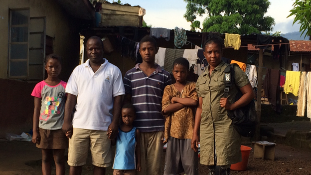 Mariatu Kagbo stands on the right of her husband and four of her children in Sierra Leone