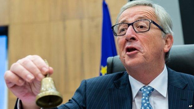 Jean-Claude Juncker rings a bell to signal the first meeting of the European Commission under his leadership