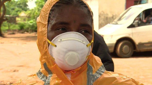 Mariatu Kagbo in a mask, Sierra Leone