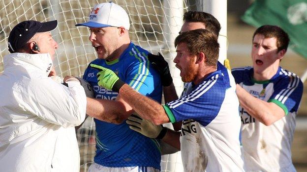 Ballinderry goalkeeper Michael Conlan and team-mates remonstrate with a match umpire following Slaughtneil's winning goal in the Derry Football Final