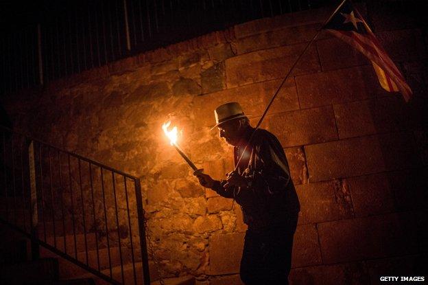 Pro-Independence Esquerra Republicana de Catalunya (ERC) supporter marches to hold a tribute to Former President of Catalonia Lluis Companys on October 15, 2014