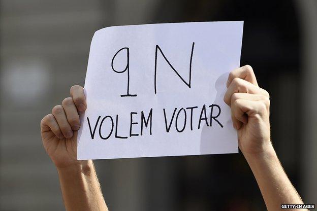 A Student holds a sign saying, 'November 9, we want to vote' during a protest in October, 2014