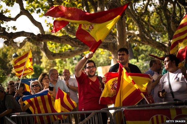 Pro-independence and anti-separatist demonstrators shout slogans outside the Catalan Parliament on September 19, 2014 in Barcelona, Spain.