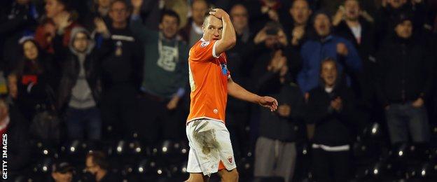 Tony McMahon walks off the pitch after being sent off at Fulham