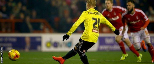 Alex Pritchard scores a penalty