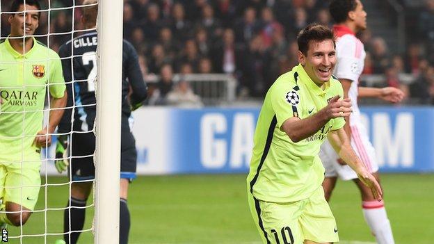 Lionel Messi celebrates scoring for Barcelona against Ajax in the Champions League