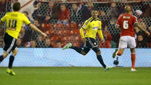 Andre Gray celebrates scoring at Nottingham Forest