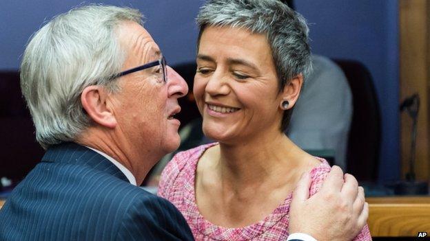 European Commission President Jean-Claude Juncker, left, greets EU Commissioner for Competition Margrethe Vestager on 5 November 2014