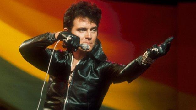 Unmistakeable with black leather gloves - and hairstyle - in the mid 1970s