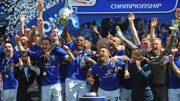 Leicester City players celebrate winning Championship