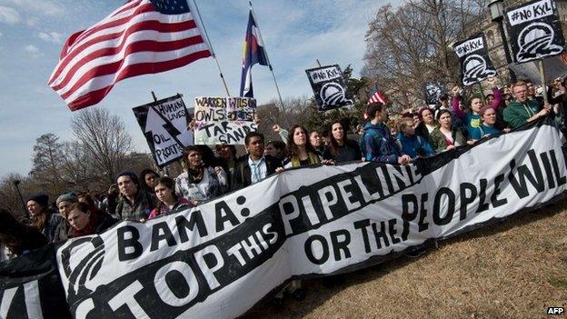 This March 2, 2014 file photo shows students protesting against the proposed Keystone XL pipeline rally in Lafayette Park across from the White House in Washington,DC