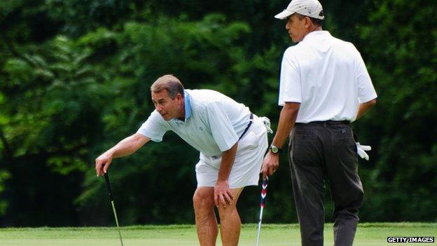 US House Speaker John Boehner (L) and US President Barack Obama watch as Ohio Governor John Kasich putts on the first hold during a game of golf Andrews Air Force Base 11 June 2011