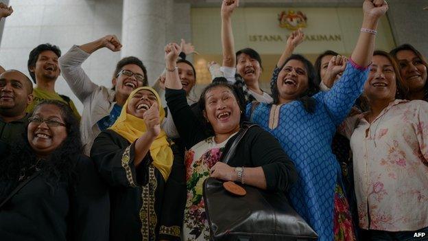 Transgender activists celebrate outside the court of appeals in Putrajaya on November 7, 2014