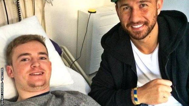 Australia fly-half Quade Cooper (right) has also donated a signed shirt to Owen Williams as he continues his recovery