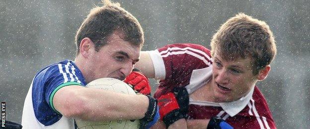 Slaughtneil's Brendan Rogers [right] battles with Ballinderry's Ryan Bell in the Derry Final