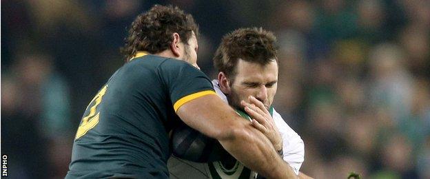 Jared Payne is tackled by Bismarck du Plessis