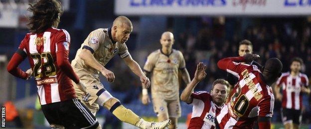 Alan Dunne shoots for the second Millwall goal