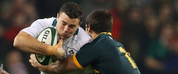 Robbie Henshaw is grabbed by Jan Serfontein at the Aviva Stadium