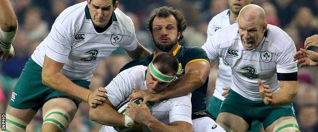 Rhys Ruddock is tackled by Bismarck du Plessis