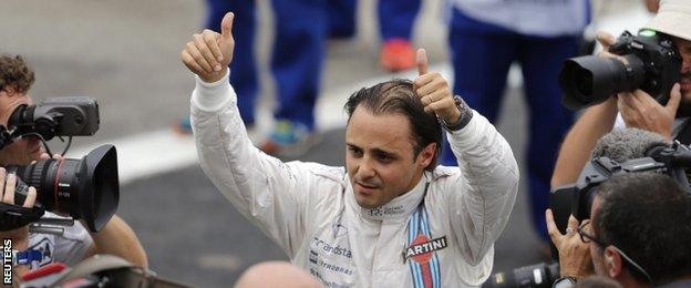 Williams Formula One driver Felipe Massa of Brazil waves after completing the qualifying session of the Brazilian Grand Prix in Sao Paulo.