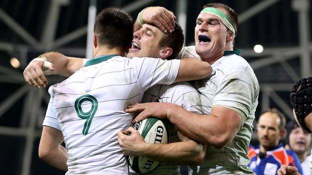 Tommy Bowe is congratulated by Conor Murray and Rhys Ruddock after scoring Ireland's second try