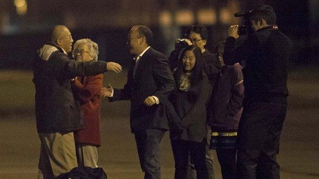 Kenneth Bae, left, is welcomed by his family at US Air Force Joint Base Lewis-McChord. 8 Nov 2014