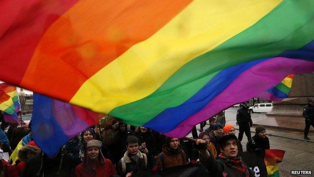 Gay rights activists marching in St Petersburg in opposition to Russian policy towards Ukraine