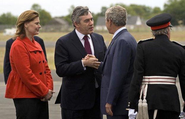 US President George W. Bush (2nd R) shakes hands with British Prime Minister Gordon Brown (2nd L) and his wife Sarah (L) as he arrives at Royal Airforce Station Aldergrove, Northern Ireland, on 16 June 2008.