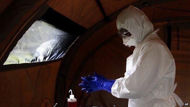 A Cuban nurse takes part in a practice drill on 22 September 2014 at a training camp for health workers in Havana due to be sent to fight Ebola