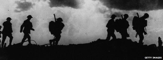 First World War British soldiers seen in silhouette on a battlefield