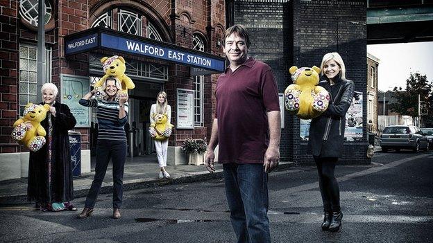 Eastenders cast members holding Pudsey Bears