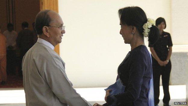 Myanmar opposition leader Aung San Suu Kyi shakes hands with Myanmar"s President Thein Sein at the presidential palace in Naypidaw