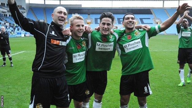 Worcester City manager Carl Heeley with three of his players (from left), Danny Jackman, George Williams and Ellis Deeney