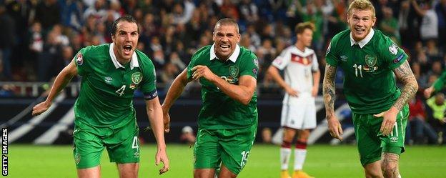 John O'Shea of the Republic of Ireland (left) celebrates scoring a stoppage time equaliser in Germany