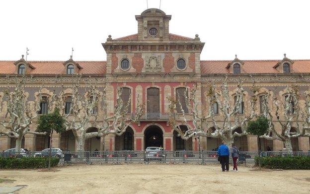 Metal security barriers have been erected outside the Catalan parliament