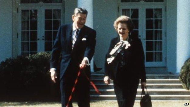 British Prime Minister Margaret Thatcher - carrying handbag - walking with US President Ronald Reagan - walking dog - outside White House.